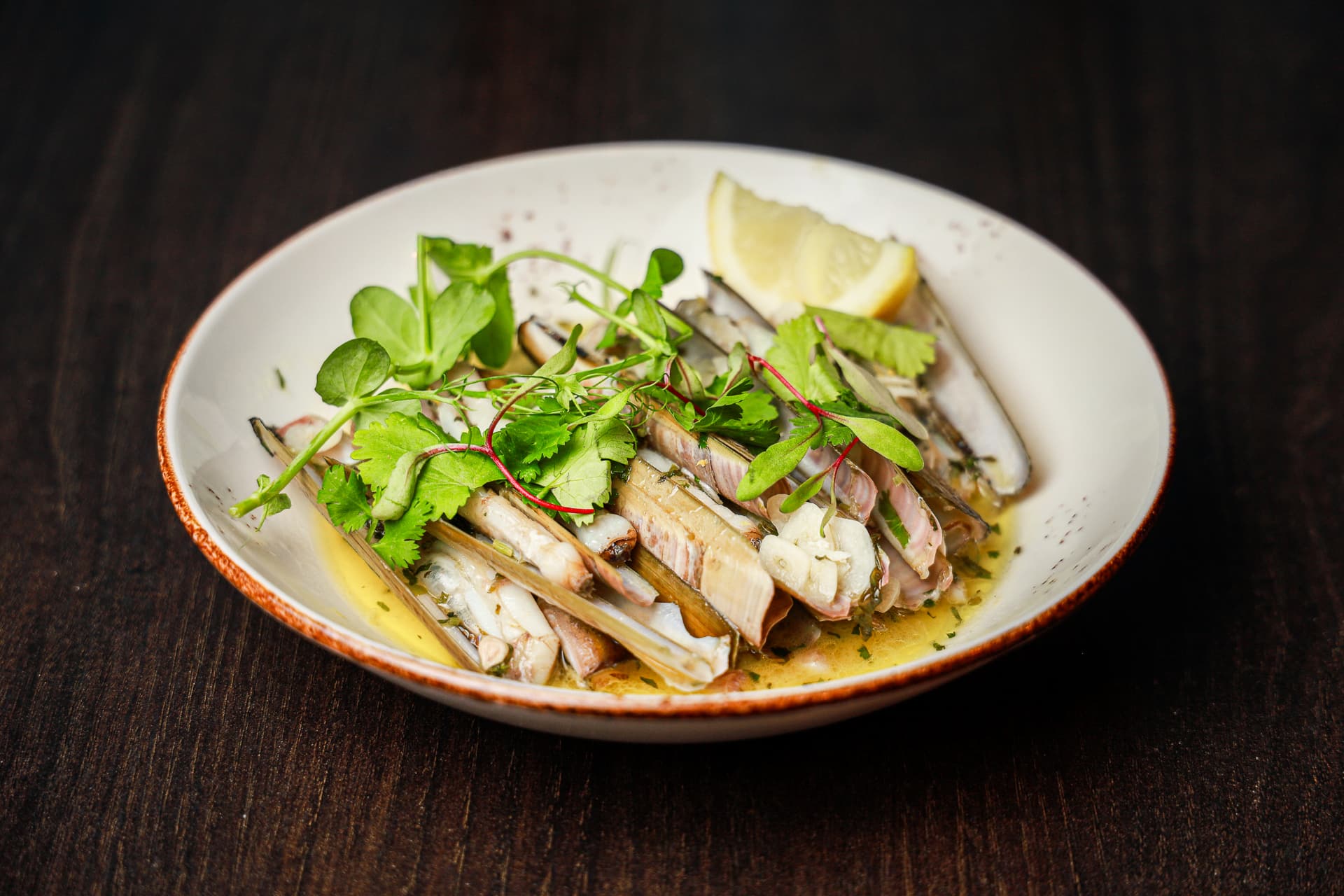 Razor clams served with herbs at Enora restaurant